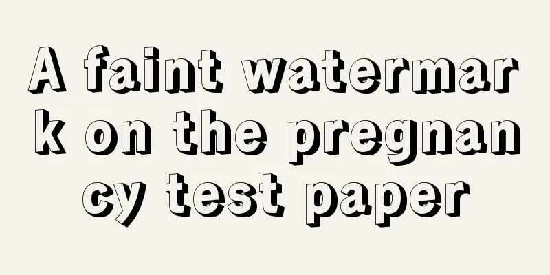 A faint watermark on the pregnancy test paper