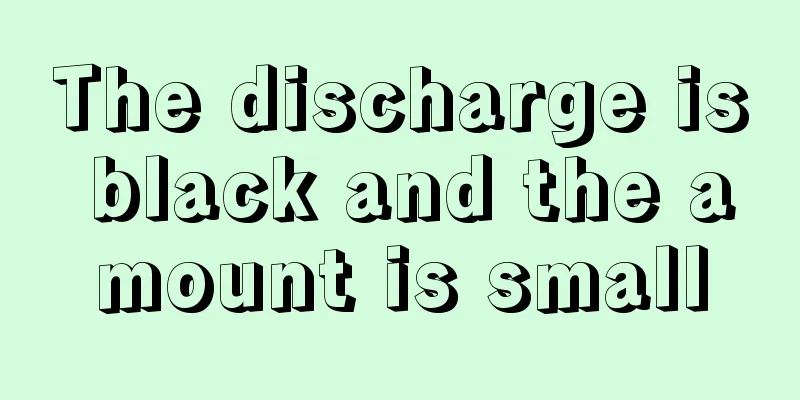 The discharge is black and the amount is small