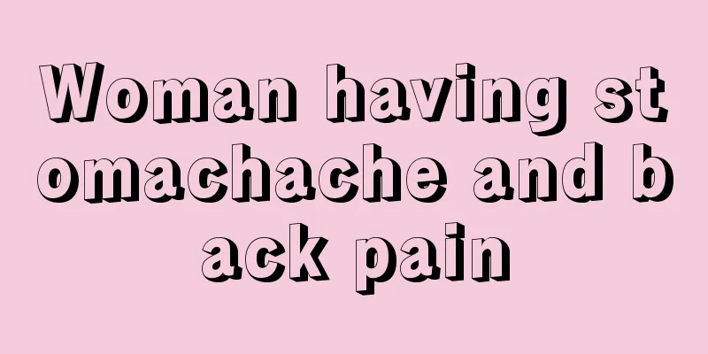 Woman having stomachache and back pain