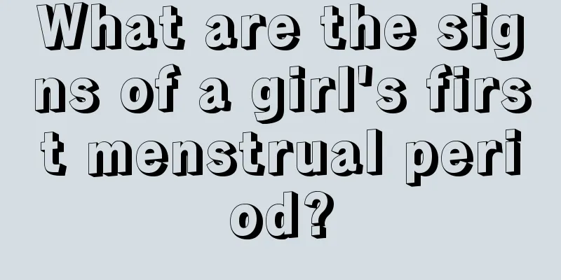 What are the signs of a girl's first menstrual period?