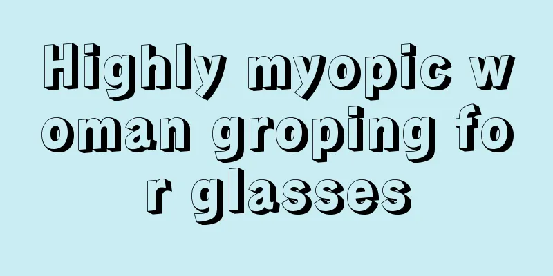 Highly myopic woman groping for glasses