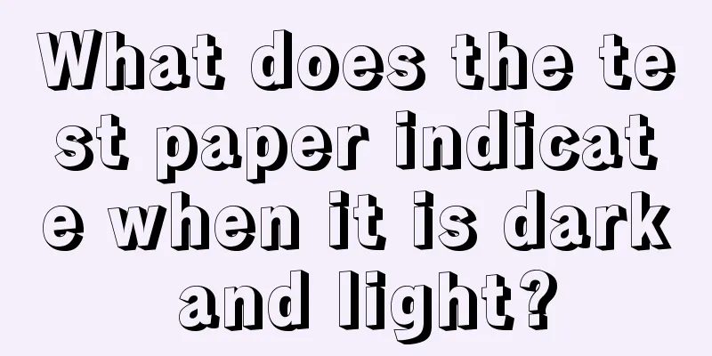 What does the test paper indicate when it is dark and light?