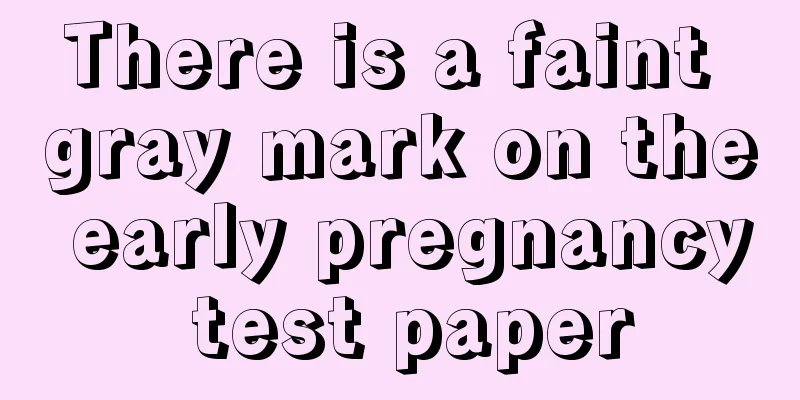 There is a faint gray mark on the early pregnancy test paper