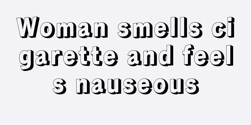 Woman smells cigarette and feels nauseous