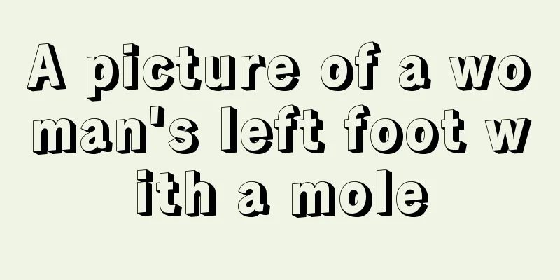 A picture of a woman's left foot with a mole