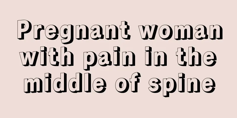 Pregnant woman with pain in the middle of spine