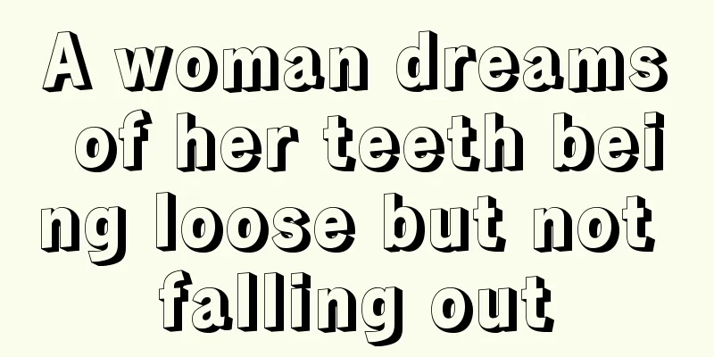 A woman dreams of her teeth being loose but not falling out