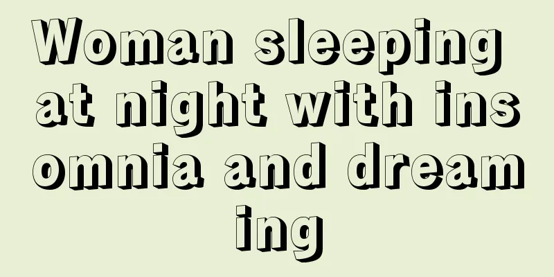 Woman sleeping at night with insomnia and dreaming