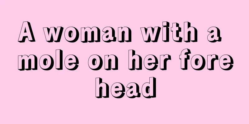 A woman with a mole on her forehead