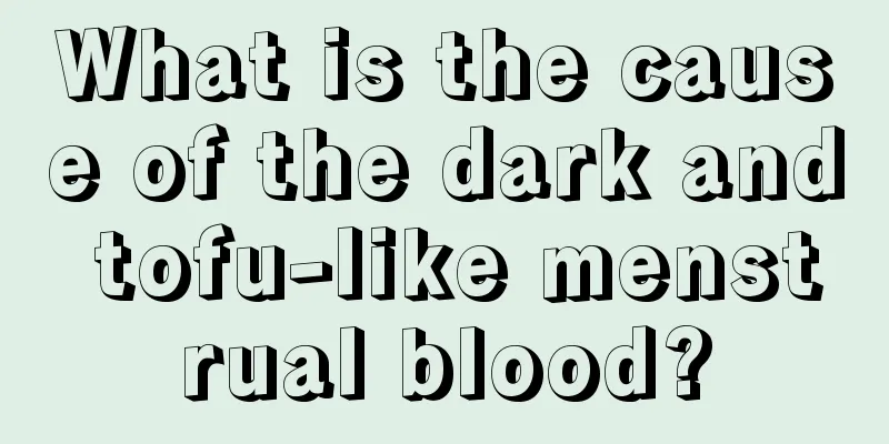 What is the cause of the dark and tofu-like menstrual blood?