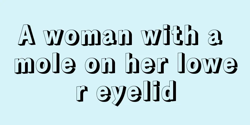 A woman with a mole on her lower eyelid