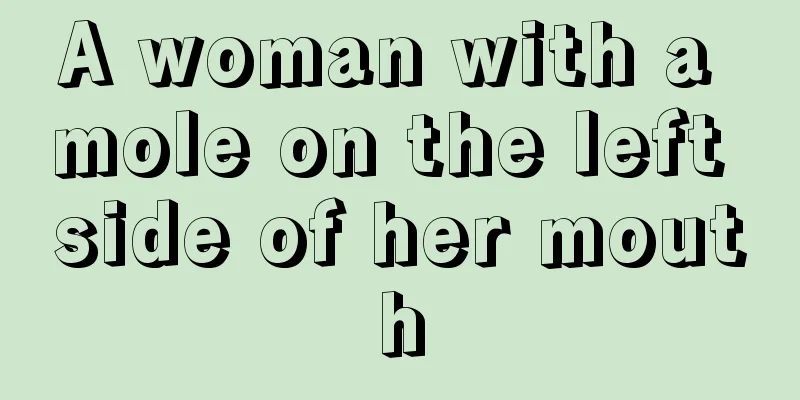 A woman with a mole on the left side of her mouth