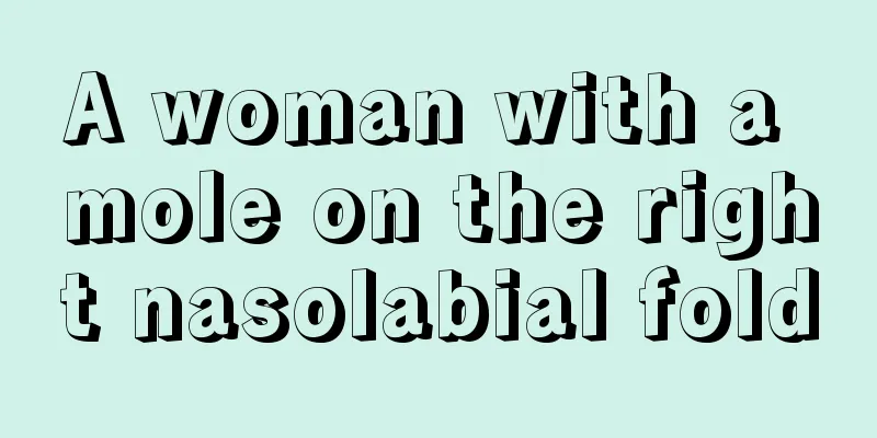 A woman with a mole on the right nasolabial fold