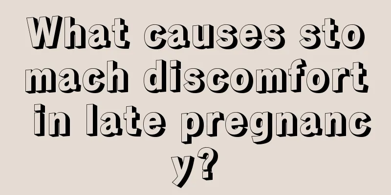 What causes stomach discomfort in late pregnancy?