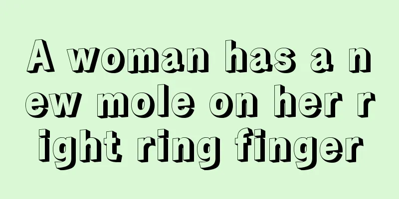 A woman has a new mole on her right ring finger