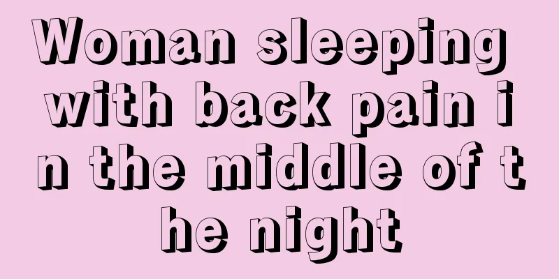 Woman sleeping with back pain in the middle of the night