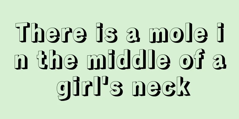 There is a mole in the middle of a girl's neck