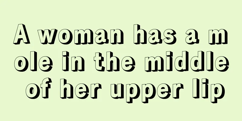 A woman has a mole in the middle of her upper lip