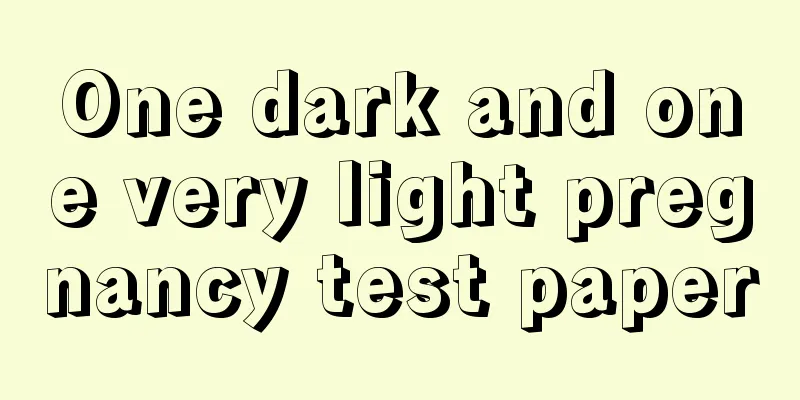 One dark and one very light pregnancy test paper