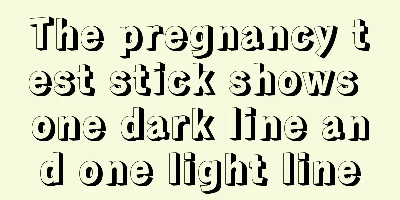 The pregnancy test stick shows one dark line and one light line