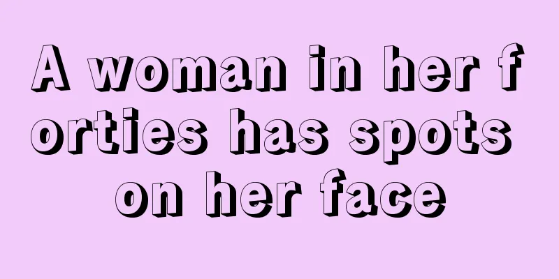 A woman in her forties has spots on her face