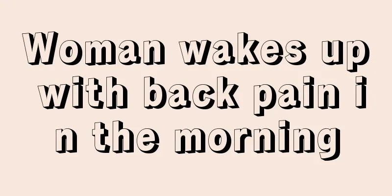 Woman wakes up with back pain in the morning