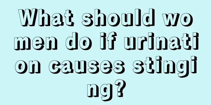 What should women do if urination causes stinging?