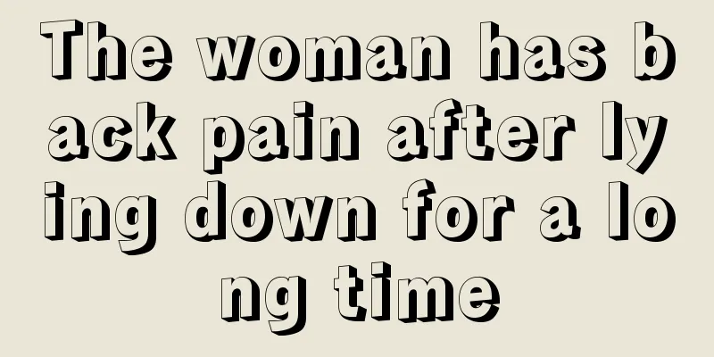 The woman has back pain after lying down for a long time