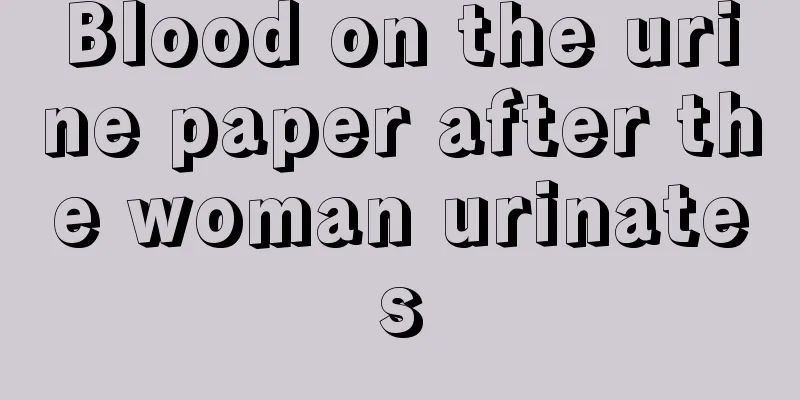 Blood on the urine paper after the woman urinates