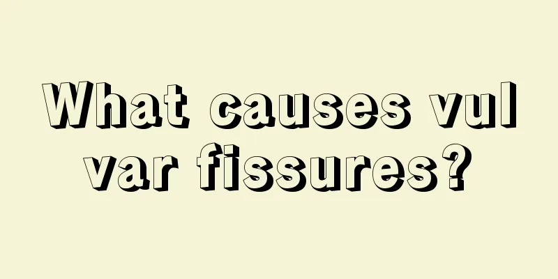 What causes vulvar fissures?