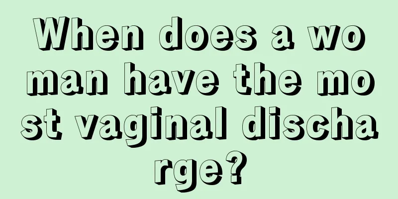 When does a woman have the most vaginal discharge?