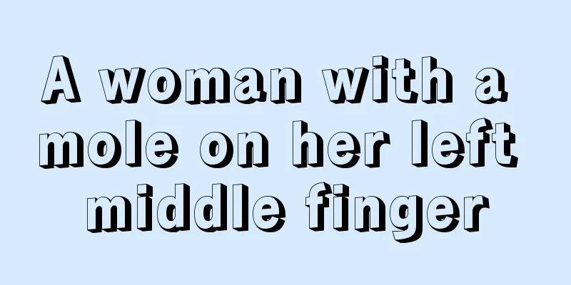 A woman with a mole on her left middle finger