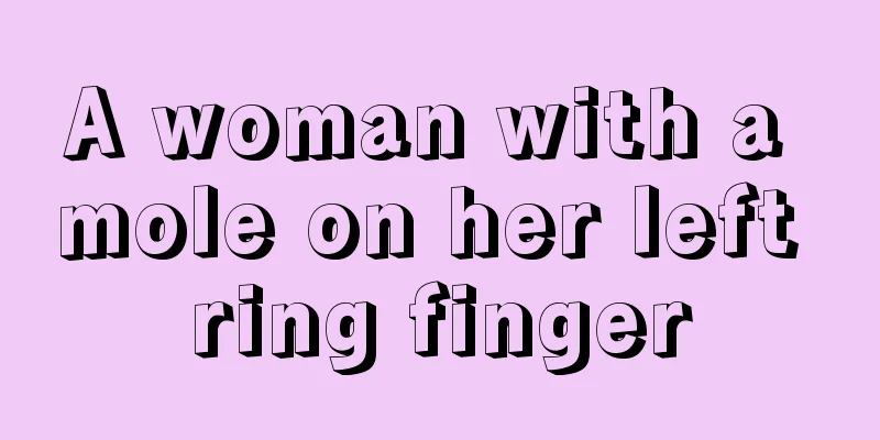 A woman with a mole on her left ring finger