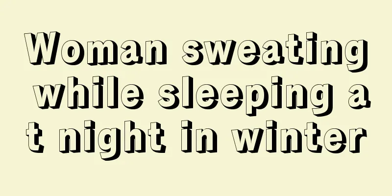 Woman sweating while sleeping at night in winter