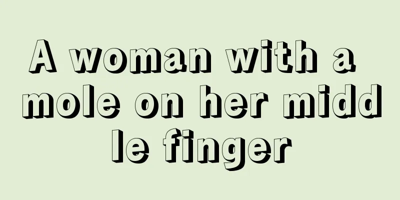 A woman with a mole on her middle finger