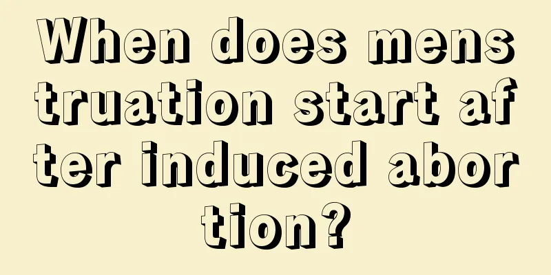 When does menstruation start after induced abortion?