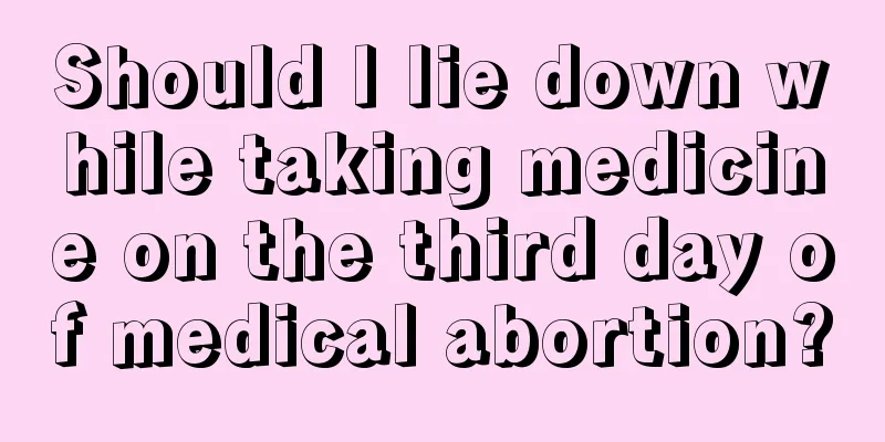 Should I lie down while taking medicine on the third day of medical abortion?