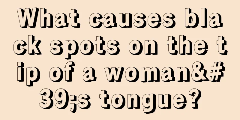 What causes black spots on the tip of a woman's tongue?