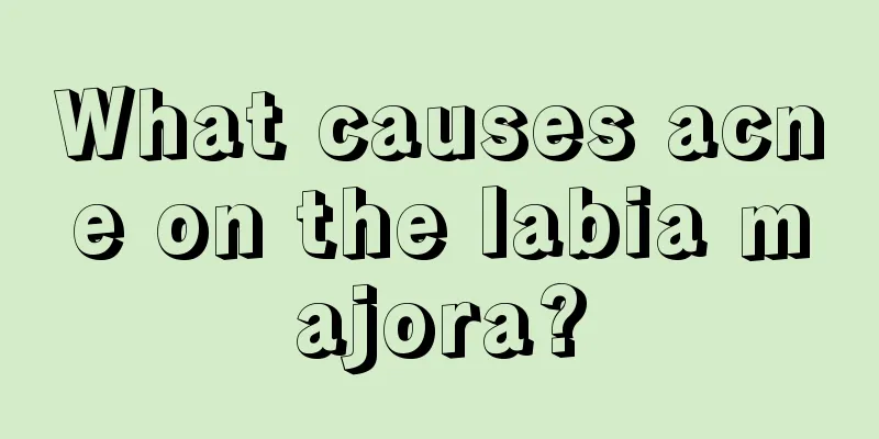 What causes acne on the labia majora?