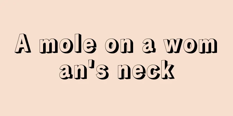 A mole on a woman's neck