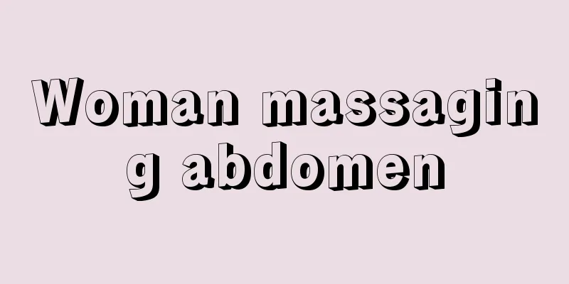 Woman massaging abdomen