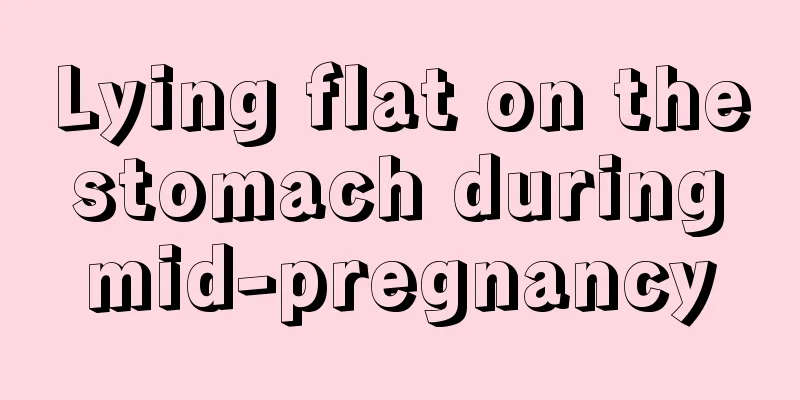 Lying flat on the stomach during mid-pregnancy