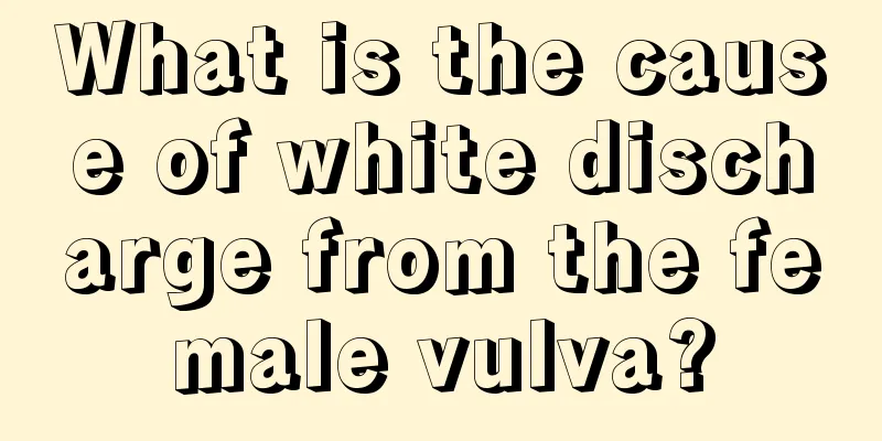 What is the cause of white discharge from the female vulva?