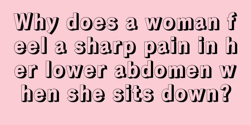 Why does a woman feel a sharp pain in her lower abdomen when she sits down?