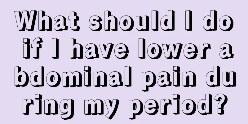 What should I do if I have lower abdominal pain during my period?