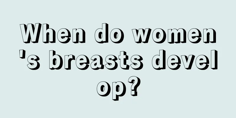 When do women's breasts develop?