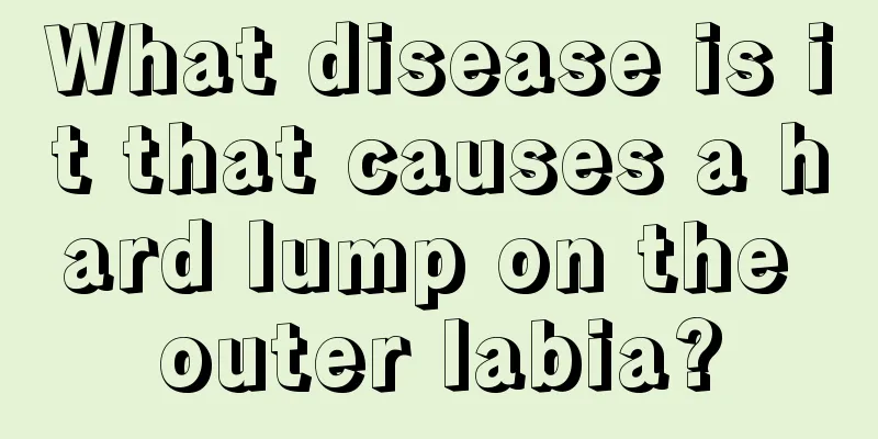 What disease is it that causes a hard lump on the outer labia?