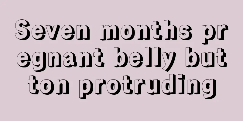 Seven months pregnant belly button protruding