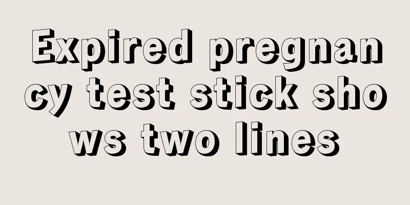 Expired pregnancy test stick shows two lines