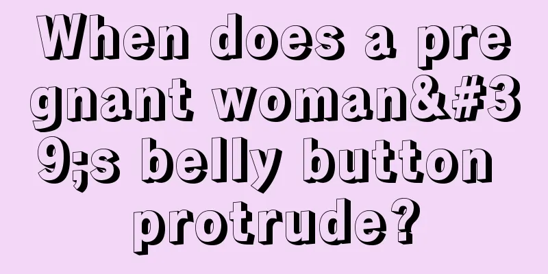 When does a pregnant woman's belly button protrude?